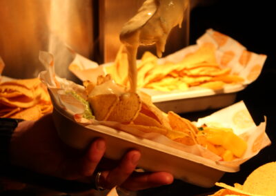 Loaded nachos with cheese pour